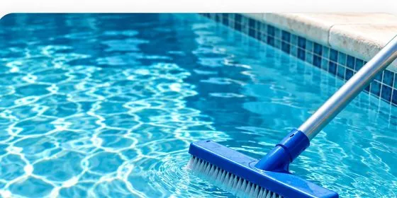 Technician providing weekly pool cleaning